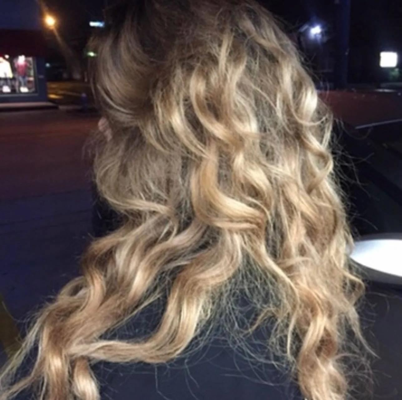 Dimensional blonde curls styled by Elizabeth